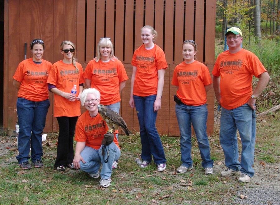 CWC Day of Caring: With Robyn Graboski in front and holding Andromeda the red-tailed hawk, from left to right the people participating are Vicki Weaver, Lauren Shurgalla, Susan Barger, Ashley Crock, Eliza Shaw, and Randy Romesberg