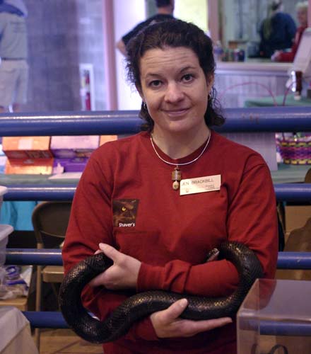 Jen Brackbill holding black rat snake